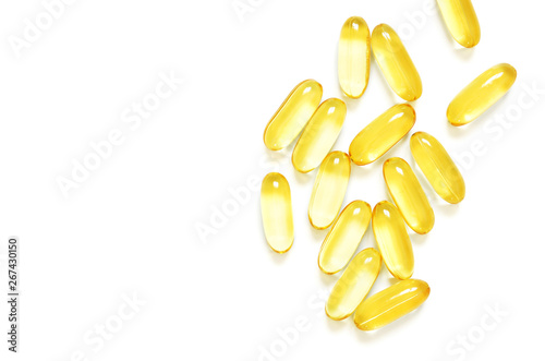 Omega 3 fish oil capsules on white background. Concept of healthcare. Top view, flat lay, copy space.