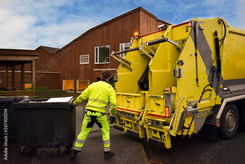 Garbage removal. Loading garbage in the garbage truck.  Work garbage collector.