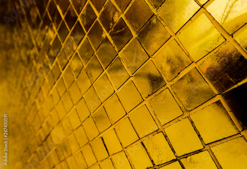 Beautiful closeup textures abstract tiles and gold and colorful glass wall background and art