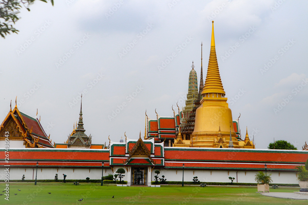 Naklejka premium Wat Phra Kaew, commonly known in English as the Temple of the Emerald Buddha or grand palace is regarded as the most sacred Buddhist temple in Thailand