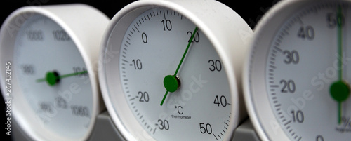 Barometer, thermometer, hygrometer isolated on black background.