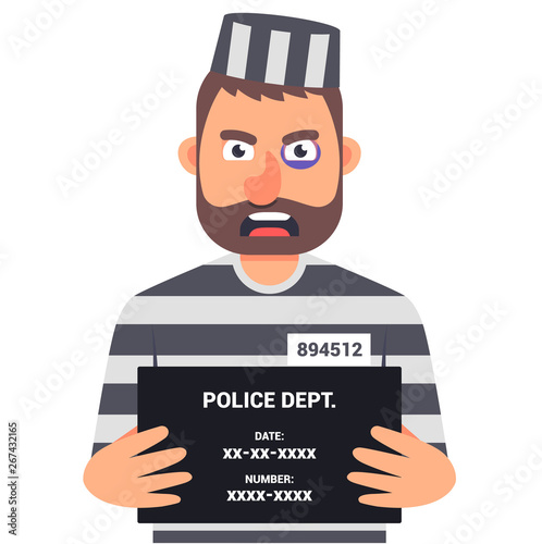 the caught criminal is holding a sign with 