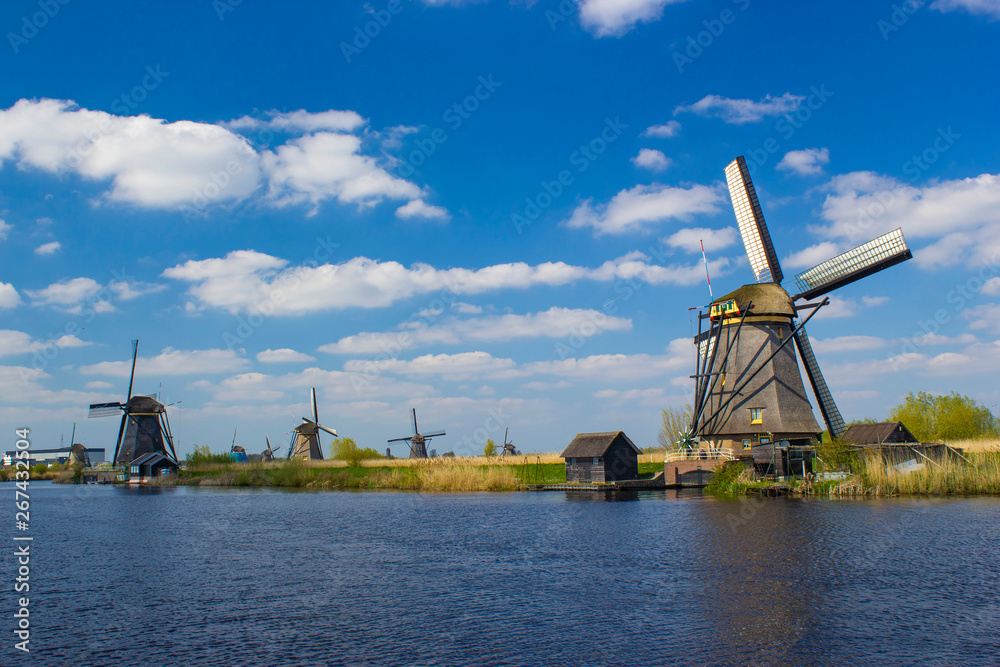 rural landscape with windmills at famous tourist site Kinderdijk in Netherlands