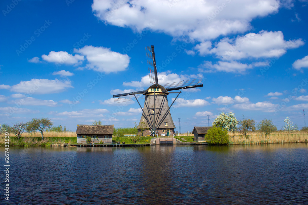 rural landscape with windmills at famous tourist site Kinderdijk in Netherlands
