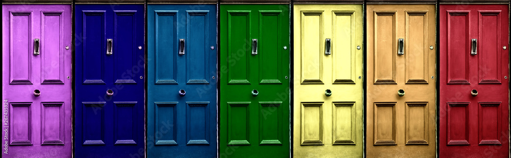 A few colorful doors in vintage style as a banner. Pink, navy blue, blue, green, yellow, orange, red door.