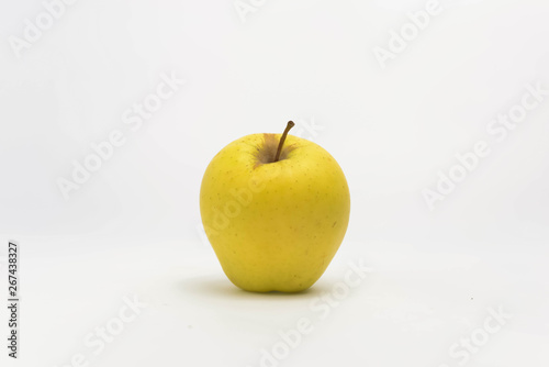 Yellow apple on white background.