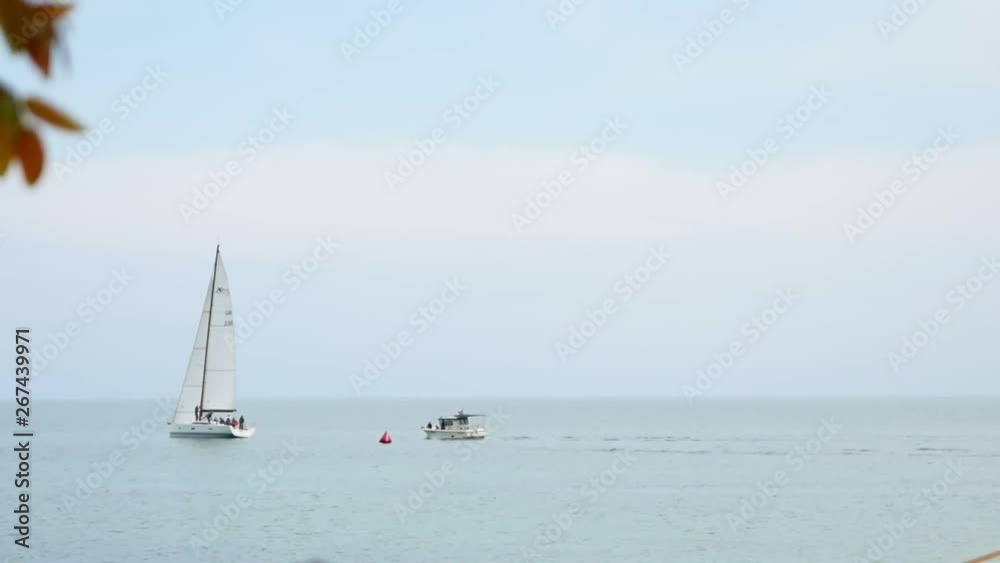 Pleasure yacht makes an excursion along the sea coast Pleasure yacht makes an excursion along the sea coast