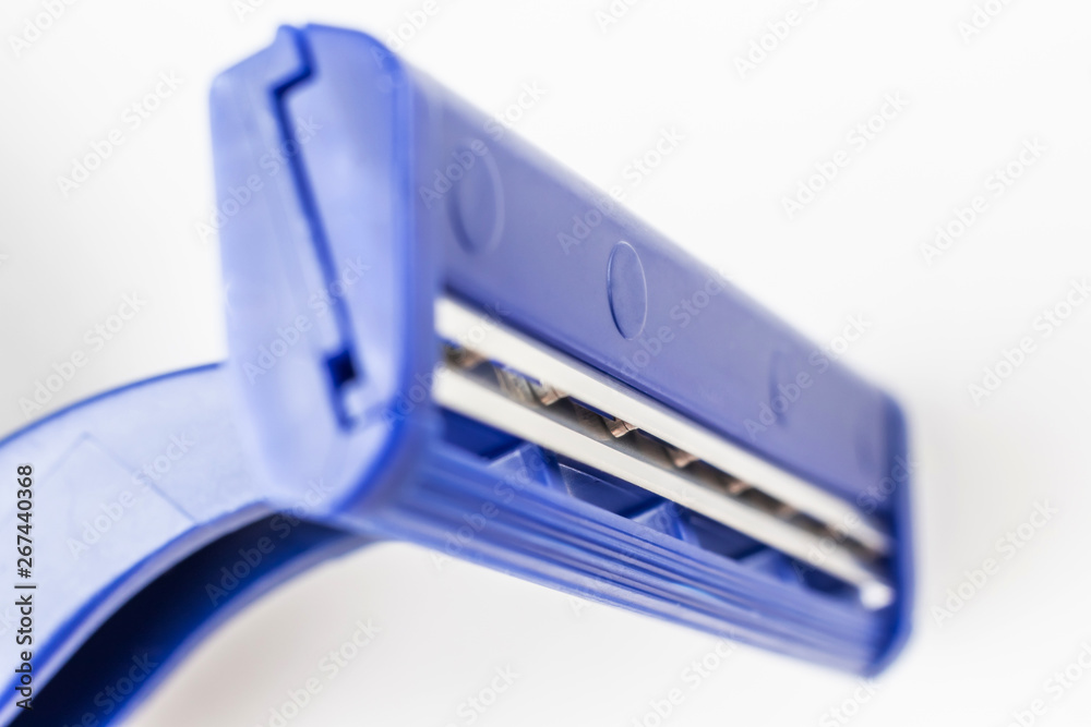 Razor close-up on a light background. Means of hygiene, shaving, removing excess hair. Hygienic procedure. Razor close-up on a light background. Means of hygiene, shaving, removing excess hair. Hygienic procedure.