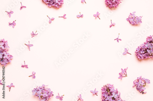Fresh lilac flowers frame composition