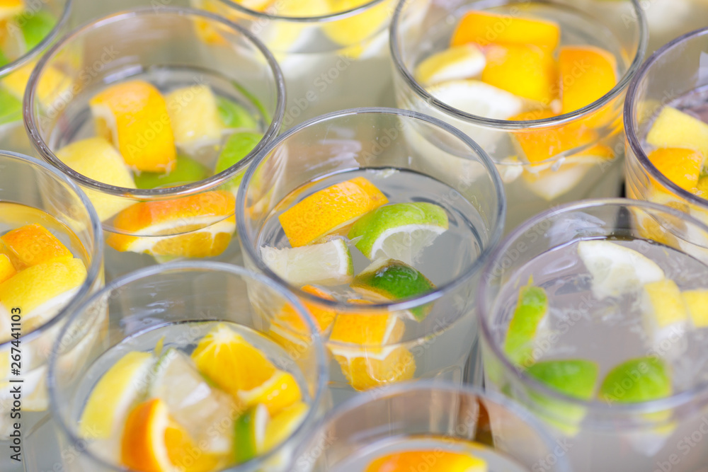 limonade in glasses, orange and lime in fress water limonade in glasses, orange and lime in fress water
