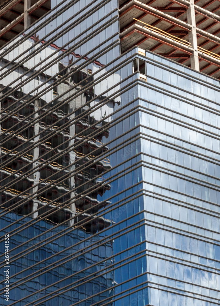 Office building construction. Mirror windows.