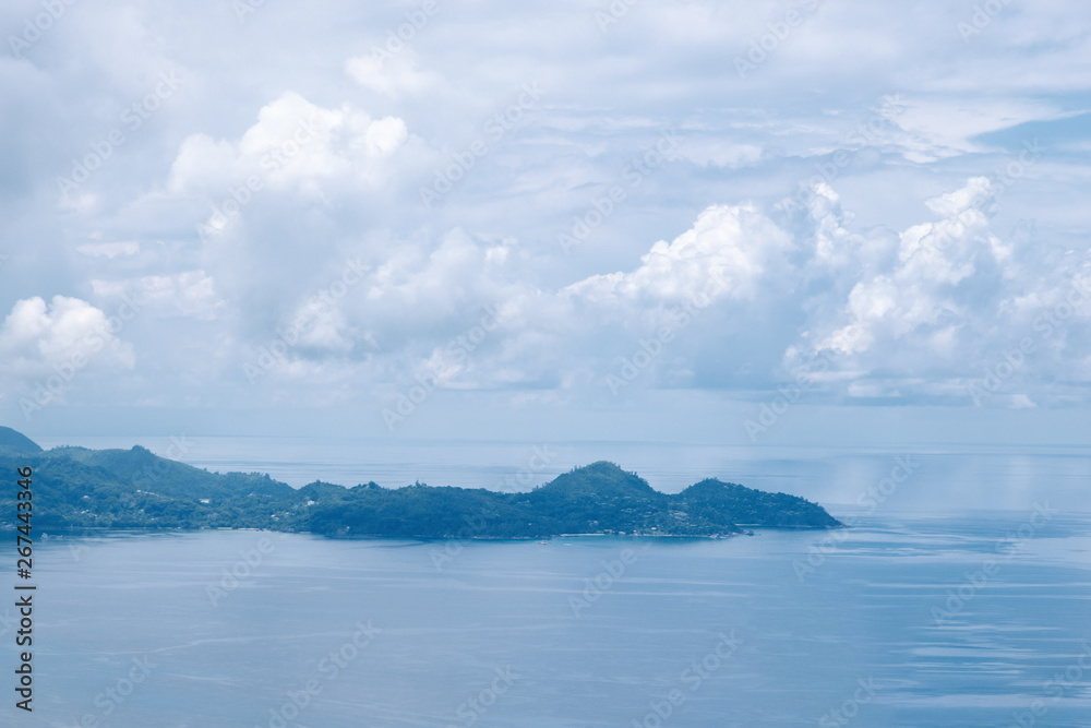 Beautiful view of the Indian Ocean and blue sky with cloud from the island of Mae, Seychelles.