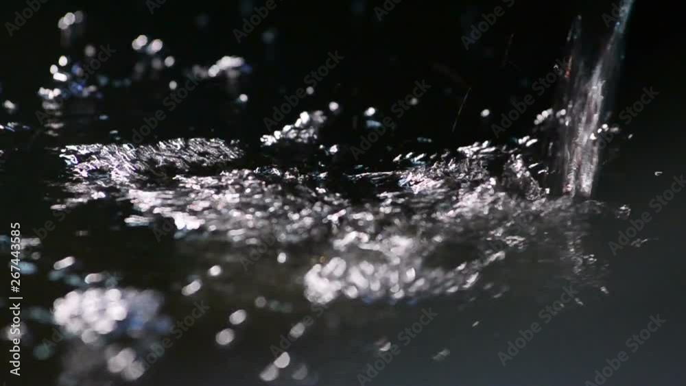Water splashing out in aqua tank, refreshing the water Water splashing out in aqua tank, refreshing the water