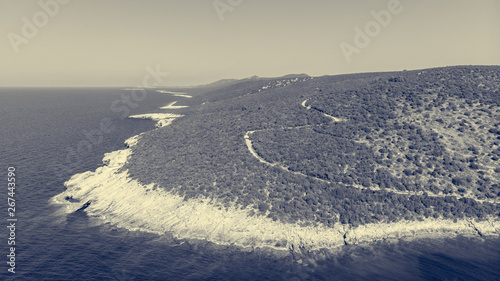 Spectacular aerial sea landscape of rocky coast and crystal clear water. photo