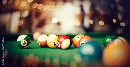 Colorful billiard balls on a billiard table. photo