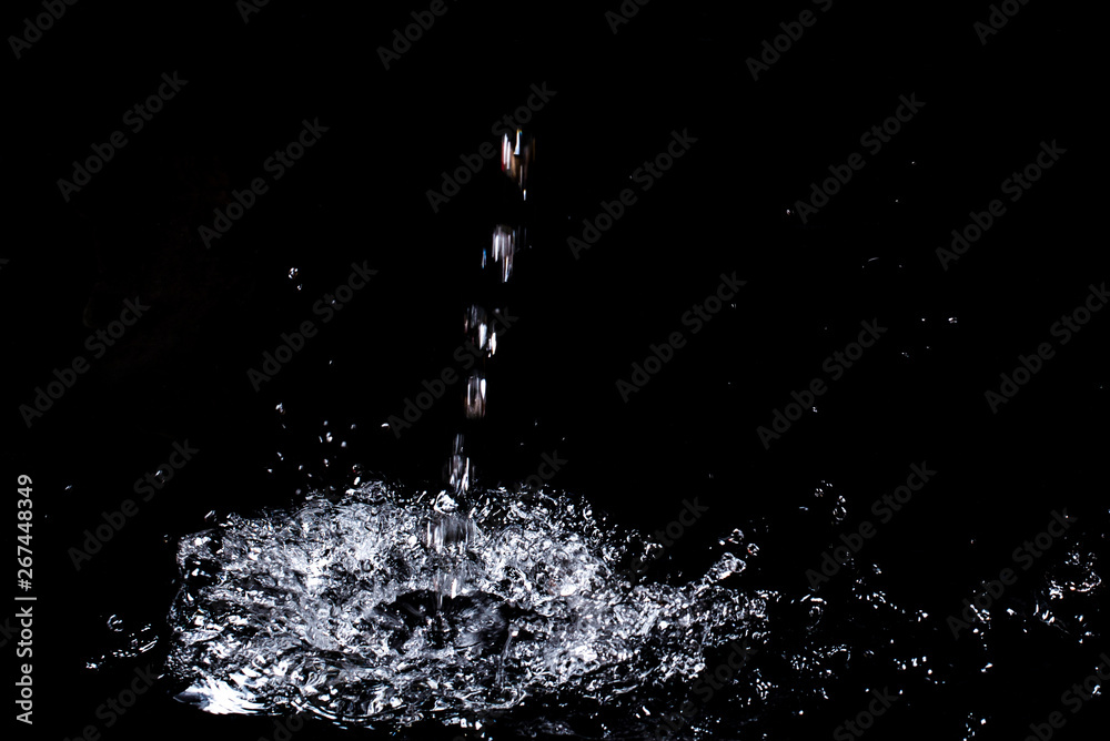 Splash of water. Isolate on black background Splash of water. Isolate on black background