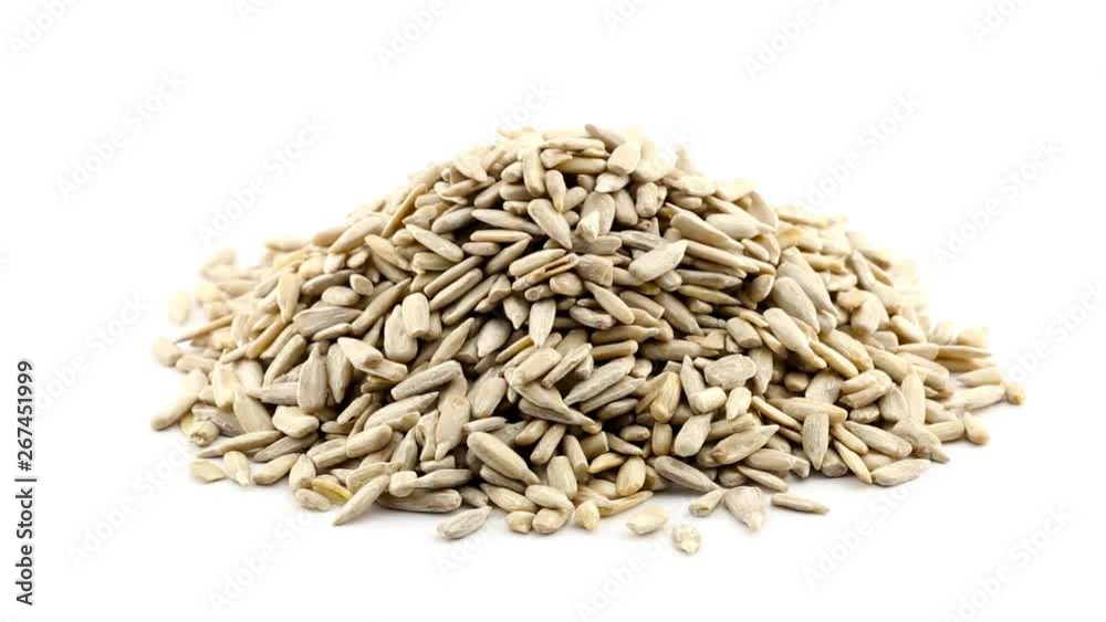 Shelled sunflower seeds rotating over white background Shelled sunflower seeds rotating over white background