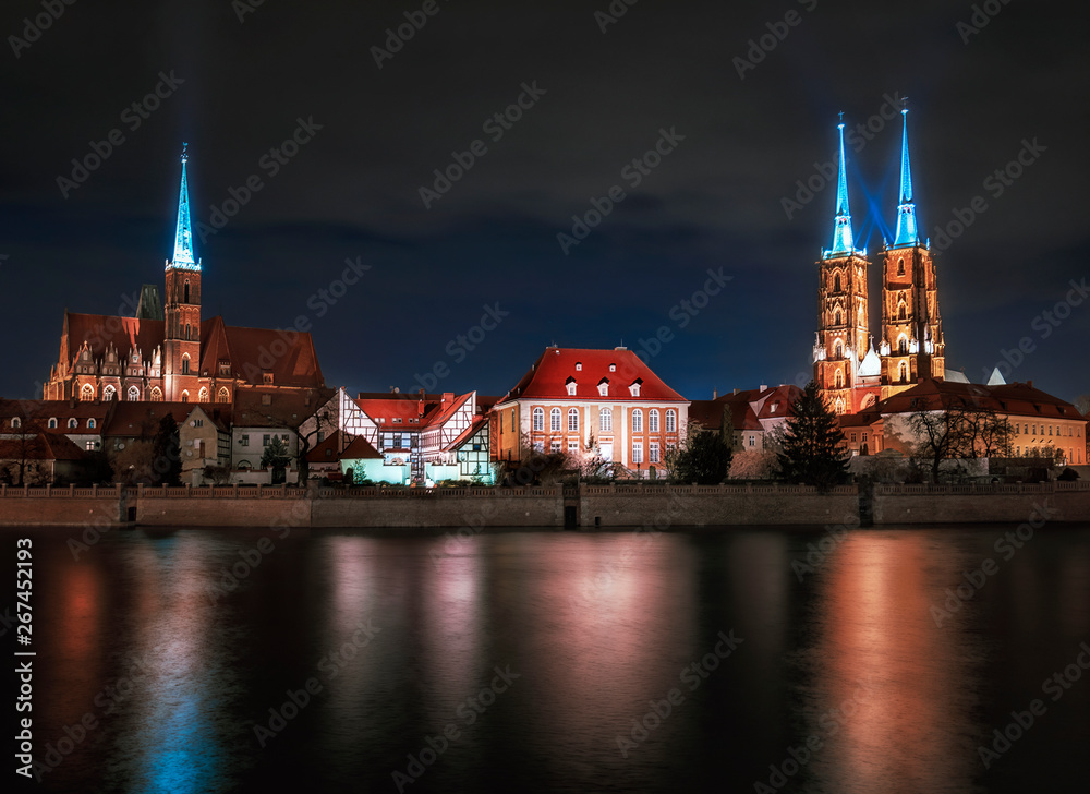 The view on the night a cityscape cathedral, river Odra. Wroclaw, Poland, dusk