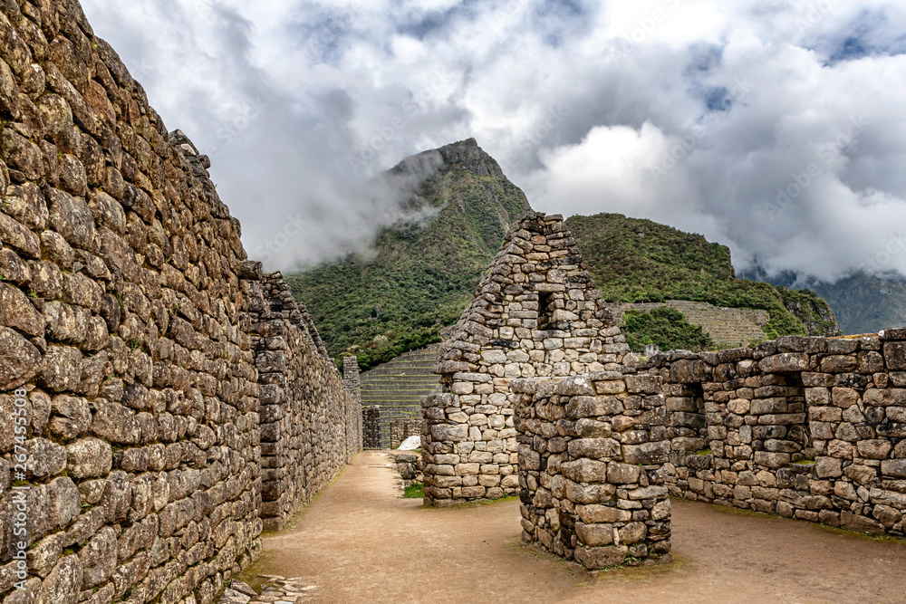 Buildings and houses structures in ancient Incas city of Machu Picchu, Cusco, Peru.