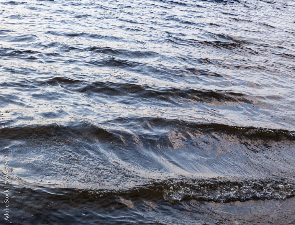 Water surface with ripples and waves. Water surface with ripples and waves.
