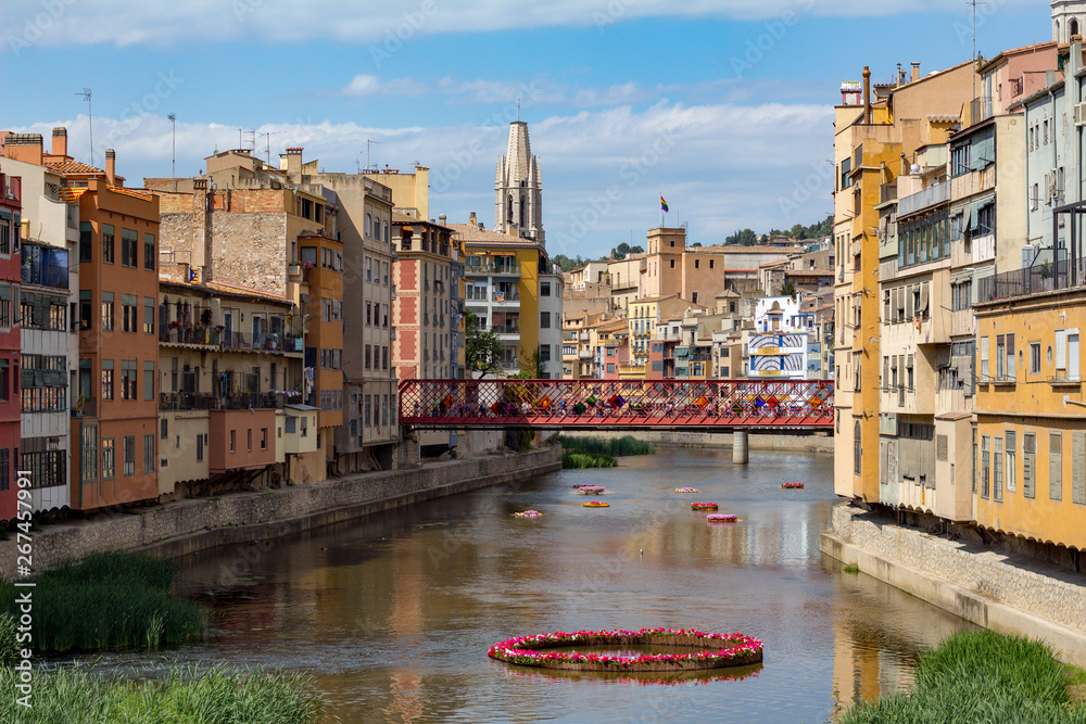 Girona river and bridge with people crossing
