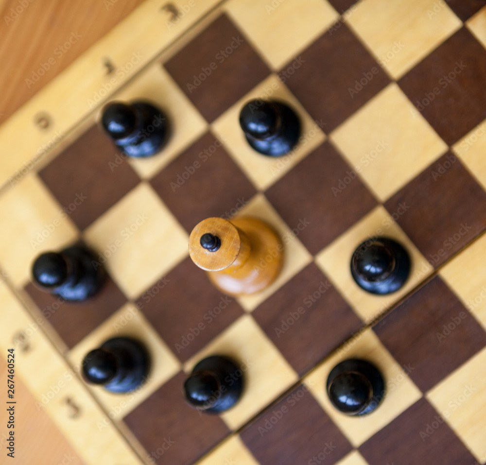 King encircled by the pawns. Chess pieces. King encircled by the pawns. Chess pieces.