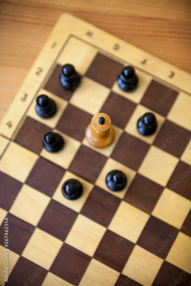 King encircled by the pawns. Chess pieces. King encircled by the pawns. Chess pieces.
