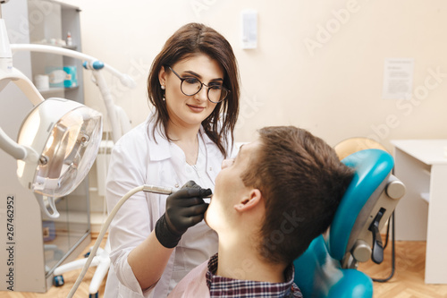 Oral care. Dentist with patient in the dentist room