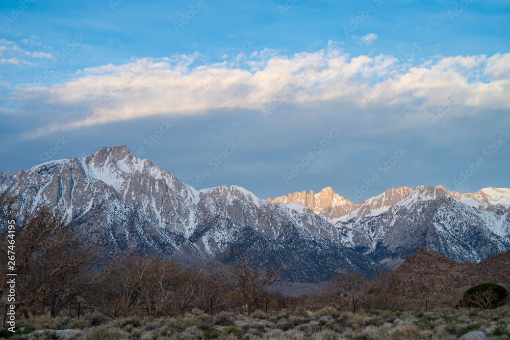 sunlight snowy peak Sierra Nevada mountains California