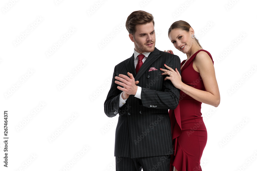 Elegant couple standing on white studio background Elegant couple standing on white studio background