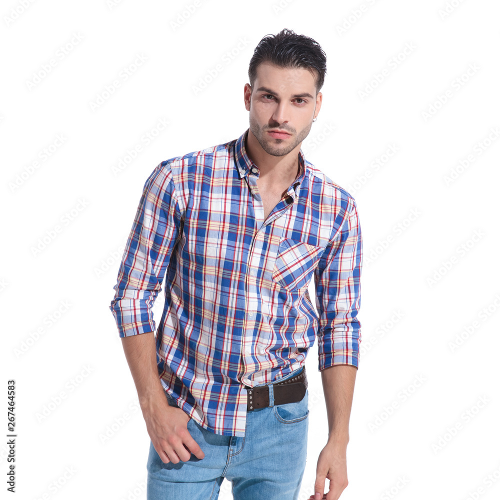 Confident man holding one of his hands in his pocket Confident man holding one of his hands in his pocket