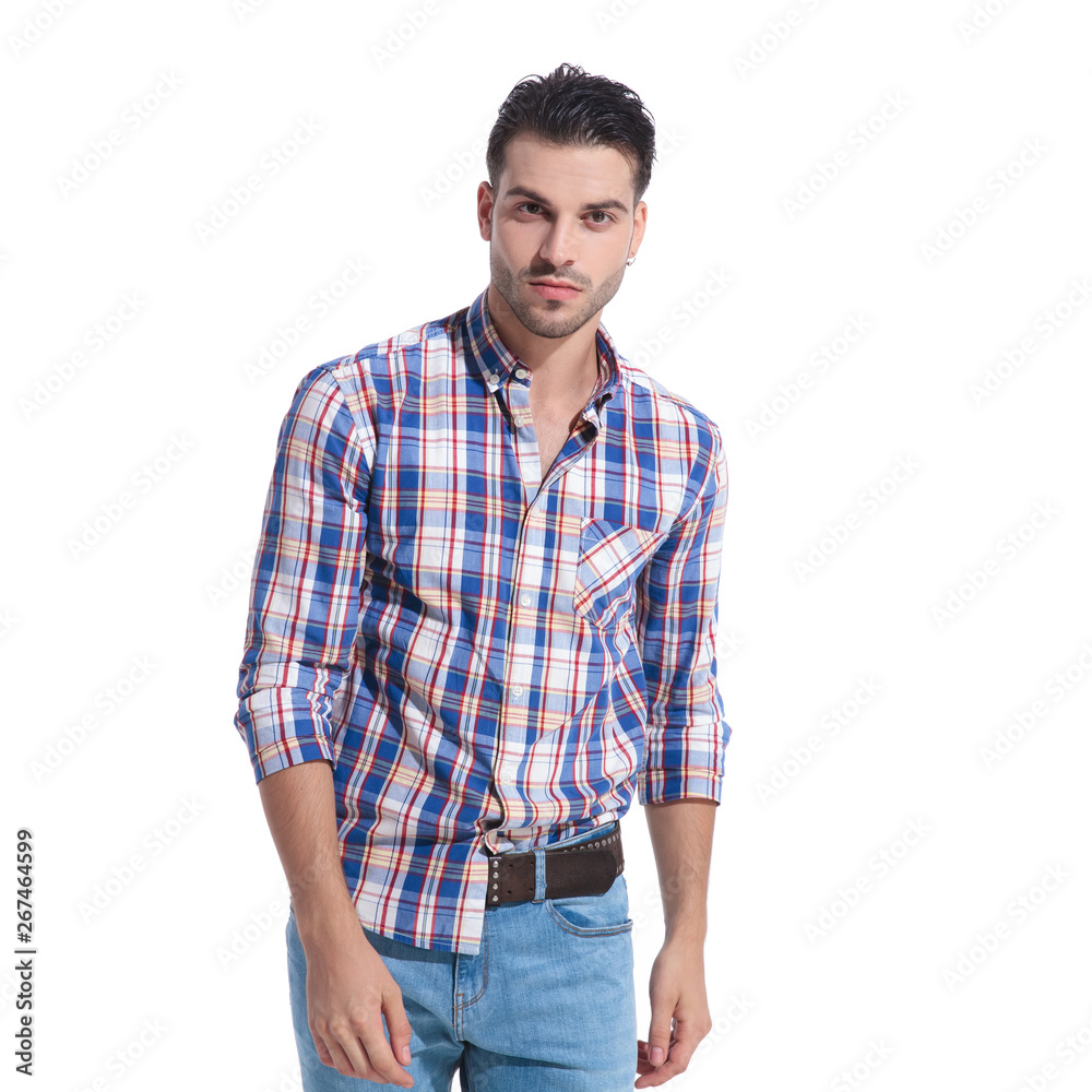 Handsome young guy wearing a messy checkered shirt Handsome young guy wearing a messy checkered shirt