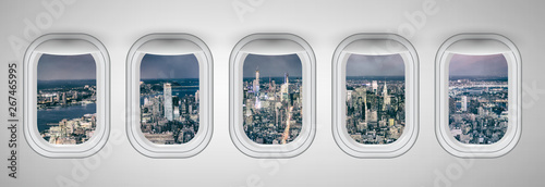 New York City at night as seen through five aircraft windows. Holiday and travel concept