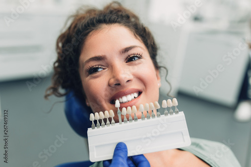 Beautiful young woman having dental treatment at dentist's office.