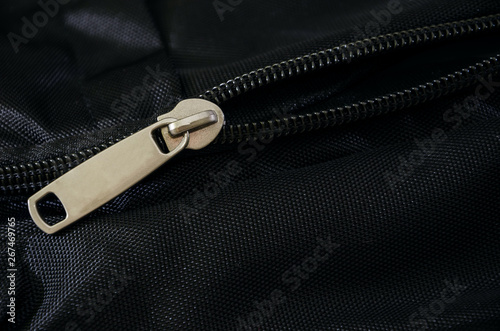 texture of a black backpack with open zipper