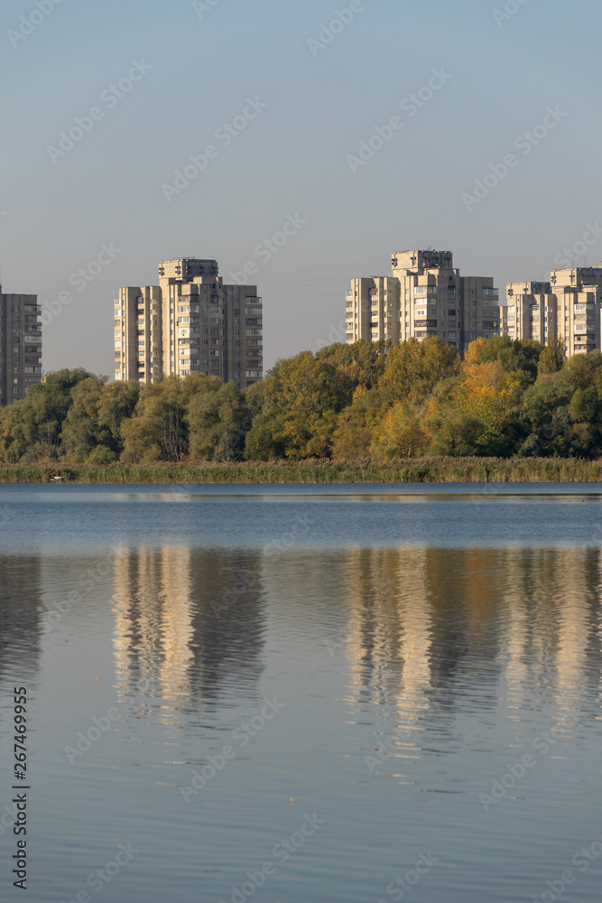 display of houses in the water. autumn sunset. lake in the park. display of houses in the water. autumn sunset. lake in the park.