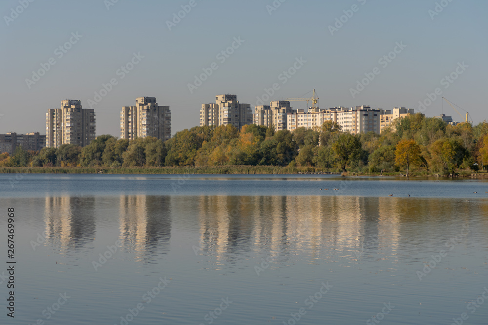 display of houses in the water. autumn sunset. lake in the park. display of houses in the water. autumn sunset. lake in the park.