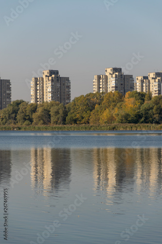 display of houses in the water. autumn sunset. lake in the park.