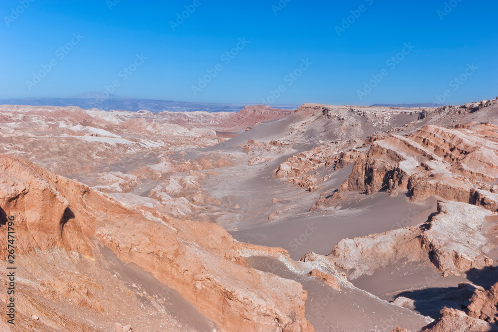 Moon Valley with surreal moonlike terrain, unusual rocky formations, sand dunes, Atacama desert, Chile, South America .