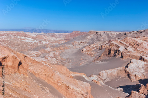 Moon Valley with surreal moonlike terrain, unusual rocky formations, sand dunes, Atacama desert, Chile, South America .
