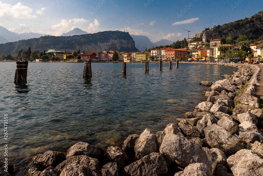 torbole, lago di garda at sundown, pitoreque old tonw with harbor, italy, holliday, harbor in italy, tuscany, sunshine, clouds