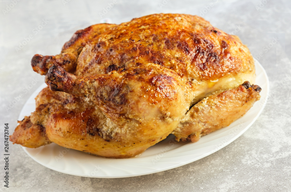 Fried chicken on a white plate. Slow cooking, farm, recipe Fried chicken on a white plate. Slow cooking, farm, recipe