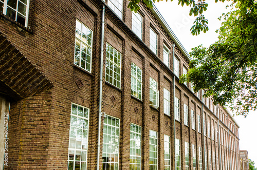 Old historical factory with brick walls and windows in Oisterwijk, Noord Brabant, Netherlands photo