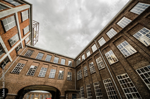 Old historical factory with brick walls and windows in Oisterwijk, Noord Brabant, Netherlands photo