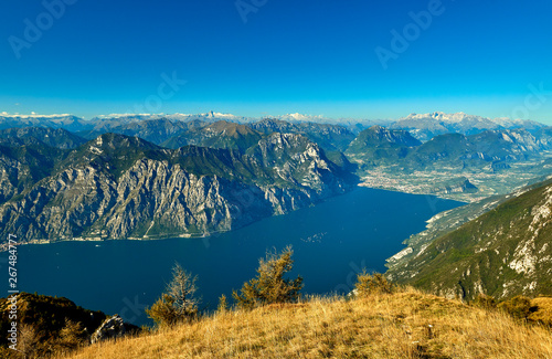 View of the Lake Garda from Monte Baldo, Italy.Panorama of the gorgeous Garda lake surrounded by mountains in the autumn