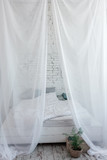 White large canopy bed on top