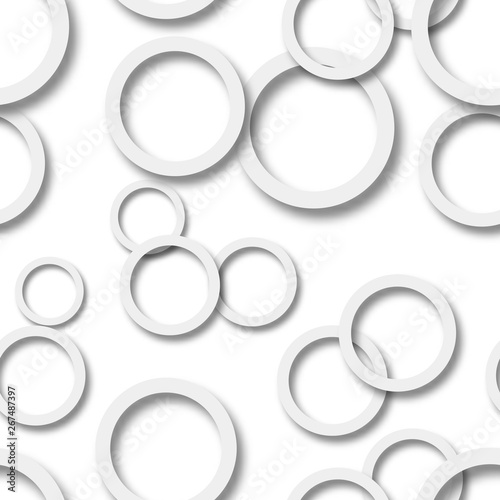 Abstract seamless pattern of randomly arranged gray rings with soft shadows on white background