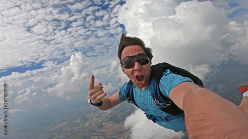 Parachutist doing a selfie in a wonderful sky