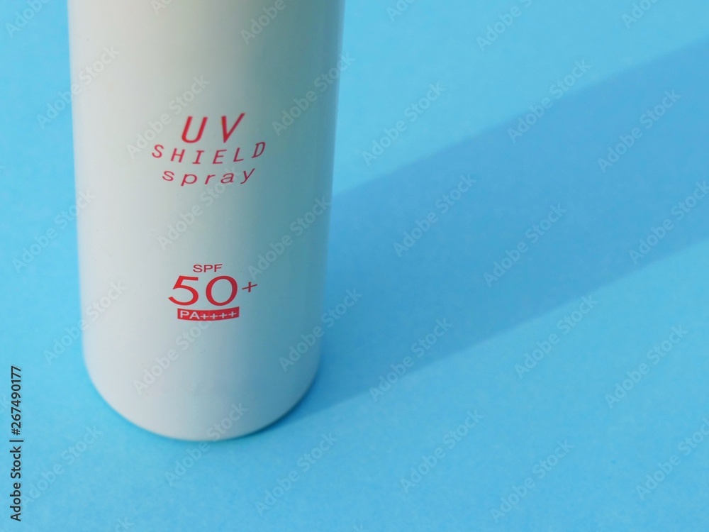 sunscreen products SPF 50+ with hand holding the product with sunlight background. the product is in Spray bolttle and plastic bottle of sunblock to body for prevent UV rays sunscreen products SPF 50+ with hand holding the product with sunlight background. the product is in Spray bolttle and plastic bottle of sunblock to body for prevent UV rays