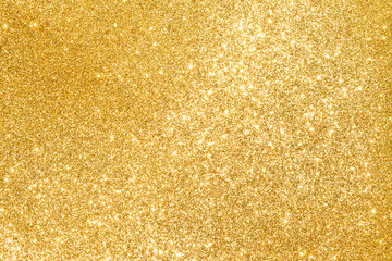 sparkles of golden glitter abstract background	